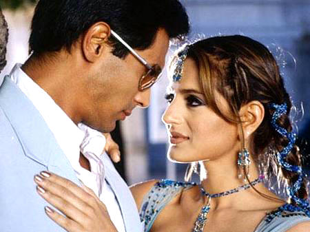 Gorgeous Amisha Patel romantic photo with Arjun Rampal in blue suit